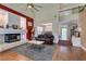 Spacious living room featuring a fireplace, high ceilings, and hardwood floors at 6686 Enchanted Cove Ct, Las Vegas, NV 89139