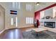 Bright living room with high ceilings, fireplace, and ample natural light at 6686 Enchanted Cove Ct, Las Vegas, NV 89139