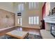 Bright living room with high ceilings, fireplace, and ample natural light at 6686 Enchanted Cove Ct, Las Vegas, NV 89139