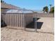 Fully fenced backyard with a chain link fence and utility shed at 6760 Fallona Ave, Las Vegas, NV 89156
