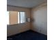 Bedroom featuring a window and blue carpeting at 6760 Fallona Ave, Las Vegas, NV 89156
