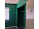 Bedroom with green walls, closet, and light carpeting at 6760 Fallona Ave, Las Vegas, NV 89156