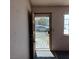 Welcoming entryway featuring unique security door and natural lighting at 6760 Fallona Ave, Las Vegas, NV 89156