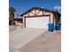 Cozy single-story home with a two-car garage, concrete driveway, and desert landscaping at 6760 Fallona Ave, Las Vegas, NV 89156