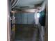 Garage featuring a white door with track lighting and storage shelves at 6760 Fallona Ave, Las Vegas, NV 89156