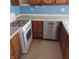 Classic kitchen featuring wooden cabinets, white countertops, and a gas range at 6760 Fallona Ave, Las Vegas, NV 89156