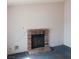 Inviting living room showcasing a classic brick fireplace at 6760 Fallona Ave, Las Vegas, NV 89156