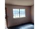 Bright living room featuring a large window for plenty of light at 6760 Fallona Ave, Las Vegas, NV 89156