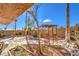 Shaded backyard featuring mature landscaping, lounging furniture, and stone at 7267 Sequoia Springs Dr, Las Vegas, NV 89147