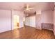 Spacious bedroom featuring laminate flooring, ceiling fan and dual door closet with storage above at 7267 Sequoia Springs Dr, Las Vegas, NV 89147