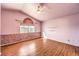 Bright bedroom featuring wood floors and a ceiling fan at 7267 Sequoia Springs Dr, Las Vegas, NV 89147