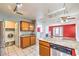 Eat in kitchen with granite counters, stainless appliances, view to the living room and laundry at 7267 Sequoia Springs Dr, Las Vegas, NV 89147