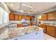 Kitchen with granite counters, stainless appliances, and view to the laundry area at 7267 Sequoia Springs Dr, Las Vegas, NV 89147