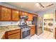 Open kitchen with stainless steel appliances, gas range, and granite countertops at 7267 Sequoia Springs Dr, Las Vegas, NV 89147