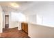 Loft area with wood floors, railing and decorative cabinets at 7267 Sequoia Springs Dr, Las Vegas, NV 89147