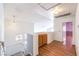 Upstairs loft area with decorative cabinets, white walls and wood floors at 7267 Sequoia Springs Dr, Las Vegas, NV 89147