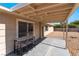 Covered patio with outdoor dining area offering a comfortable space for entertaining guests at 7817 Aplin Ave, Las Vegas, NV 89145