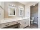 Bright bathroom featuring dual sinks, white cabinets, and modern finishes at 7817 Aplin Ave, Las Vegas, NV 89145