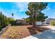 Charming single-story home with a well-maintained front yard and mature landscaping at 7817 Aplin Ave, Las Vegas, NV 89145