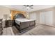 Spacious main bedroom with decorative bed frame, side tables and ensuite access at 7817 Aplin Ave, Las Vegas, NV 89145