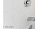 Close-up of a white shower with chrome fixtures and clean design at 7817 Aplin Ave, Las Vegas, NV 89145
