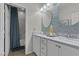 Stylish bathroom features a double sink vanity with decorative backsplash and modern fixtures at 8 Via Dolcetto, Henderson, NV 89011
