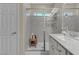 Bathroom with tiled shower, glass door, white vanity, and plenty of countertop space at 8 Via Dolcetto, Henderson, NV 89011
