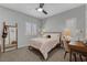 Comfortable bedroom boasts natural light from shuttered windows and a dedicated study area at 8 Via Dolcetto, Henderson, NV 89011