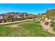 Neighborhood greenbelt featuring walking paths, desert landscaping and mountain views at 8 Via Dolcetto, Henderson, NV 89011