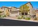 Charming two-story stucco home featuring a paved driveway and an attached two-car garage at 8 Via Dolcetto, Henderson, NV 89011