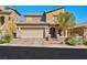 Charming two-story stucco home featuring a paved driveway and an attached two-car garage at 8 Via Dolcetto, Henderson, NV 89011