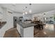 Bright kitchen with large island, stainless appliances, and open floor plan at 8 Via Dolcetto, Henderson, NV 89011