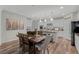 Open floorplan with a view of the dining area and kitchen with granite countertops and modern appliances at 8 Via Dolcetto, Henderson, NV 89011