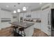 Spacious kitchen with an island, granite countertop, and modern light fixtures at 8 Via Dolcetto, Henderson, NV 89011