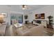 Living room features a neutral palette, access to the outdoor patio, and a ceiling fan at 8 Via Dolcetto, Henderson, NV 89011