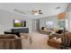 Large living room with plush sofas, ceiling fan, and recessed lighting at 8 Via Dolcetto, Henderson, NV 89011