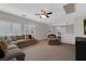 Spacious upstairs living room with sectional sofa and wall-mounted TV at 8 Via Dolcetto, Henderson, NV 89011