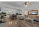 Spacious living room showcases wood floors and open concept to the kitchen at 8 Via Dolcetto, Henderson, NV 89011