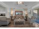 Comfortable seating area in the living room features wood floors and natural light at 8 Via Dolcetto, Henderson, NV 89011