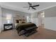 A spacious bedroom features neutral décor, carpeted floors, and lots of natural light at 8 Via Dolcetto, Henderson, NV 89011