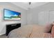 Main bedroom features a mounted TV and ample closet space for optimal storage at 8 Via Dolcetto, Henderson, NV 89011