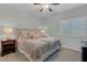 Cozy main bedroom with a ceiling fan, plantation shutters, and warm ambient lighting at 8 Via Dolcetto, Henderson, NV 89011