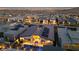 Stunning aerial view of modern home featuring a backyard pool, patio, and solar panels with city views at 803 Bolide St, Las Vegas, NV 89138