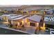 Aerial view of a luxury home featuring modern design, desert landscaping, and convenient parking at 803 Bolide St, Las Vegas, NV 89138