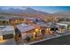 Aerial view of modern homes showcasing desert landscaping and mountain views in the background at 803 Bolide St, Las Vegas, NV 89138