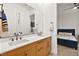 Modern bathroom features double sinks with stylish fixtures and a door that leads to the bedroom at 803 Bolide St, Las Vegas, NV 89138