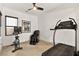 Dedicated home exercise room with treadmill, stationary bike, and massage chair at 803 Bolide St, Las Vegas, NV 89138