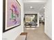 Bright hallway with views of the pool and living spaces, featuring tile flooring at 803 Bolide St, Las Vegas, NV 89138
