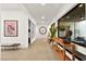 Hallway features an accent wall and natural light, with views into the courtyard at 803 Bolide St, Las Vegas, NV 89138