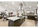 Spacious open kitchen with stainless steel appliances and a large central island at 803 Bolide St, Las Vegas, NV 89138
